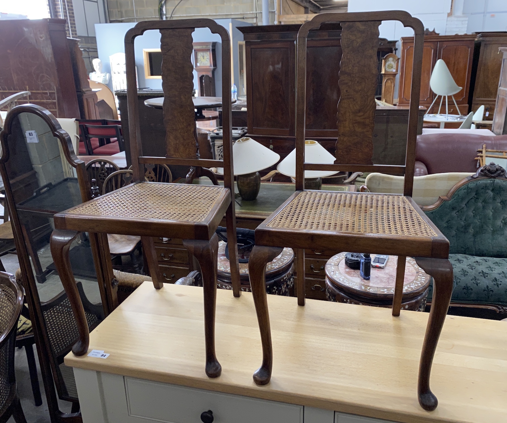 A Queen Anne revival walnut cheval mirror, width 39cm, depth 45cm, height 159cm and a pair of cane seat side chairs